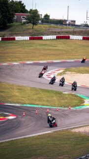 Thrilling High-Speed Motorcycle Road Race Action Mobile Wallpaper