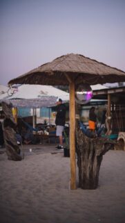 Relaxing Beach Bar Vibes with Disco Ball Sunset Background Wallpaper