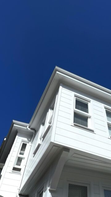 Minimalist White House Architecture Under Deep Blue Sky Wallpaper