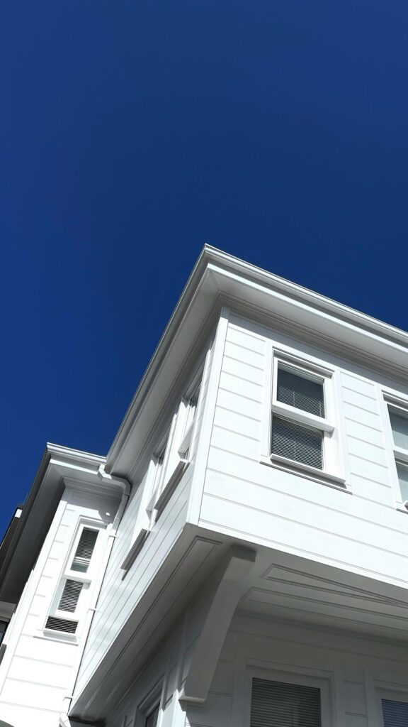 Minimalist White House Architecture Under Deep Blue Sky Wallpaper
