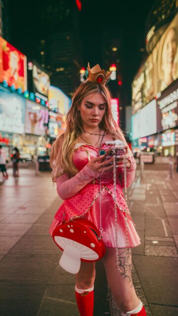 Princess Peach Cosplay in Times Square City Lights Mobile Wallpaper