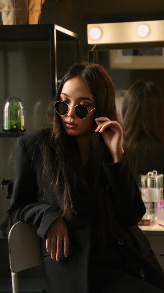 Chic Fashionista in Black Blazer and Sunglasses Mobile Wallpaper