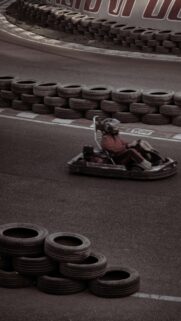 Dynamic Go-Kart Racing Speed on Track Mobile Phone Wallpaper