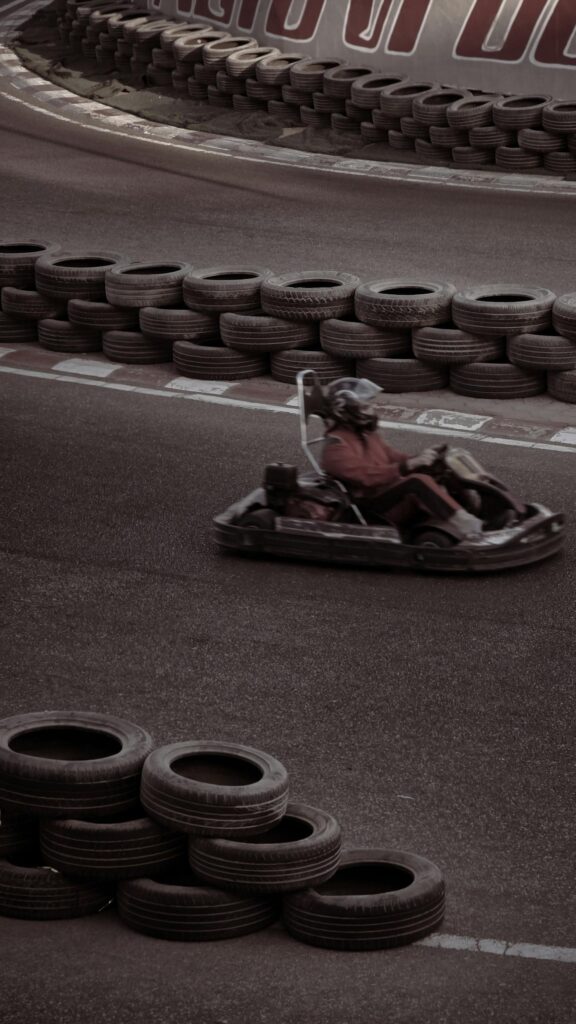 Dynamic Go-Kart Racing Speed on Track Mobile Phone Wallpaper