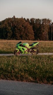 Lime Green Kawasaki Ninja ZX-6R Sportbike in Golden Hour Wallpaper