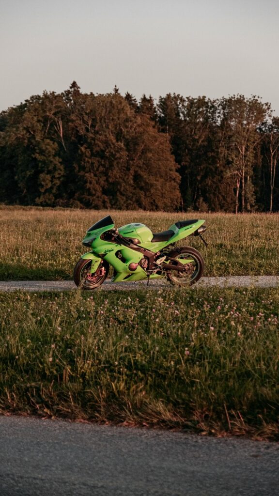Lime Green Kawasaki Ninja ZX-6R Sportbike in Golden Hour Wallpaper