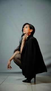 Elegant Woman in Black Blazer Professional Fashion Portrait Wallpaper