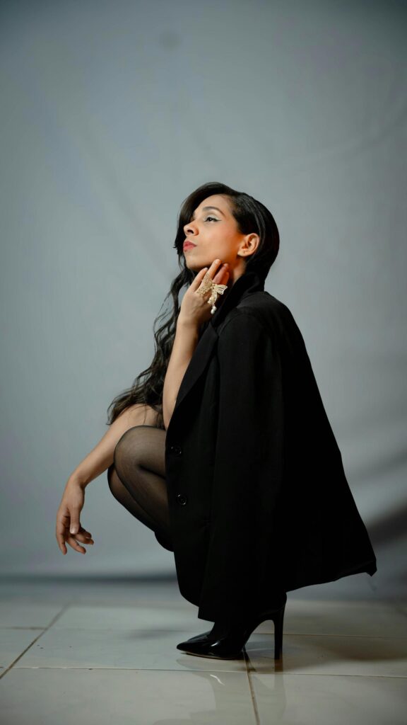 Elegant Woman in Black Blazer Professional Fashion Portrait Wallpaper