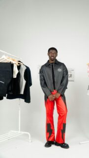 Stylish Man in Red Leather Lightning Pants and Jacket Portrait Wallpaper