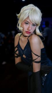 Beautiful Blonde Cosplayer in Elegant Blue Evening Gown Wallpaper
