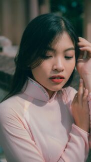 Stunning Asian Woman in Pink Traditional Ao Dai Portrait Wallpaper
