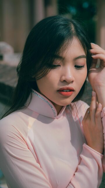 Stunning Asian Woman in Pink Traditional Ao Dai Portrait Wallpaper