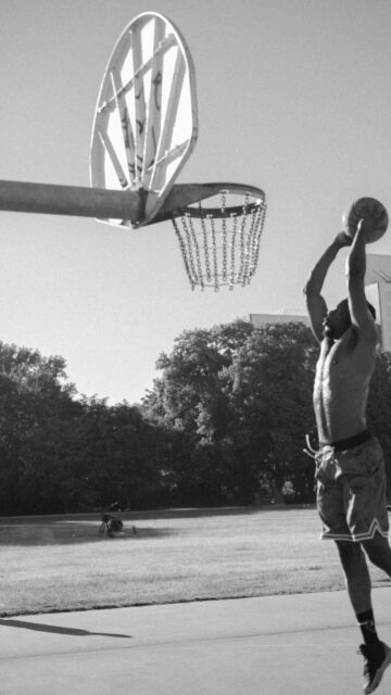 Black and White Basketball Player Dunking Vertical Phone Wallpaper