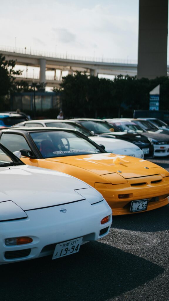 JDM Nissan 180SX Lineup with Yellow and White Sports Cars Wallpaper