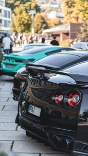 Aggressive Nissan GT-R and Sports Car Lineup Mobile Wallpaper