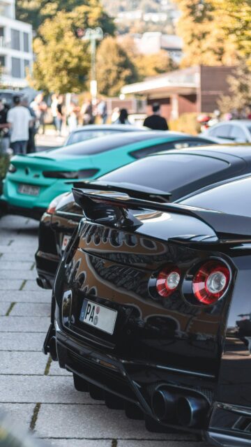 Aggressive Nissan GT-R and Sports Car Lineup Mobile Wallpaper