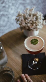Elegant Cocktail Drink with Mint Garnish Luxury Table Wallpaper