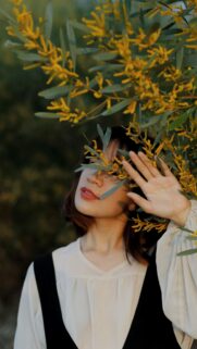 Dreamy Woman With Golden Mimosa Flowers Mobile Phone Wallpaper