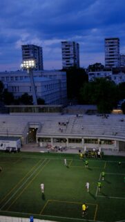 Evening Football Match at Stadium Urban Landscape Wallpaper