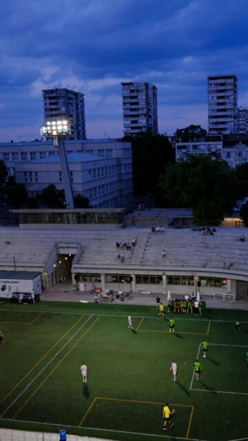 Evening Football Match at Stadium Urban Landscape Wallpaper