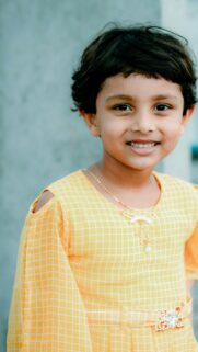 Cute Little Girl in Yellow Plaid Dress Portrait 4K Mobile Wallpaper