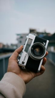 Vintage Yashica Camera in Hand Aesthetic Photography Mobile Wallpaper