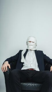 Funny Man in Suit Wrapped in Toilet Paper Creative Portrait Wallpaper