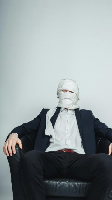 Funny Man in Suit Wrapped in Toilet Paper Creative Portrait Wallpaper