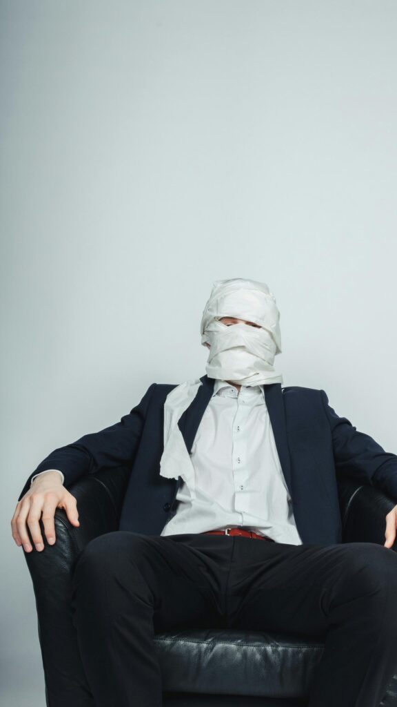 Funny Man in Suit Wrapped in Toilet Paper Creative Portrait Wallpaper