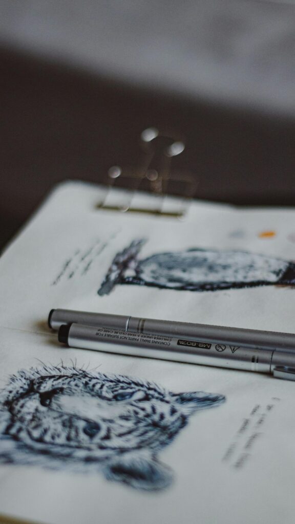 Artistic Tiger Sketch with Drawing Pens Aesthetic Phone Wallpaper