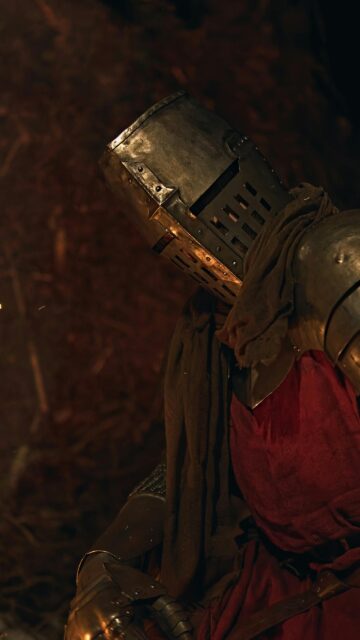 Stunning Medieval Knight in Dark Armor Mobile Wallpaper
