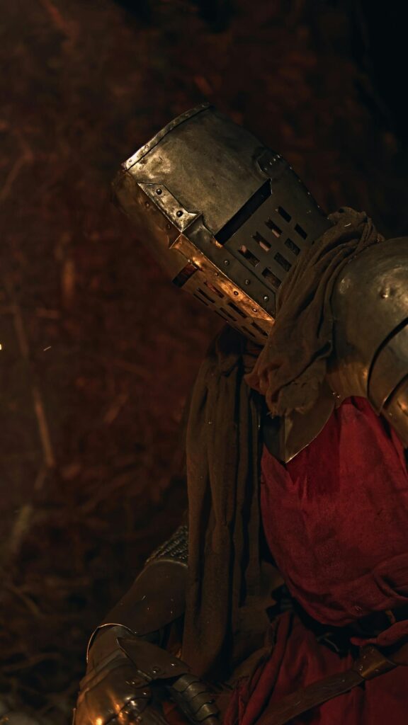 Stunning Medieval Knight in Dark Armor Mobile Wallpaper