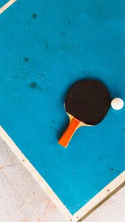 High Angle Table Tennis Paddle and Ball Blue Sports Wallpaper