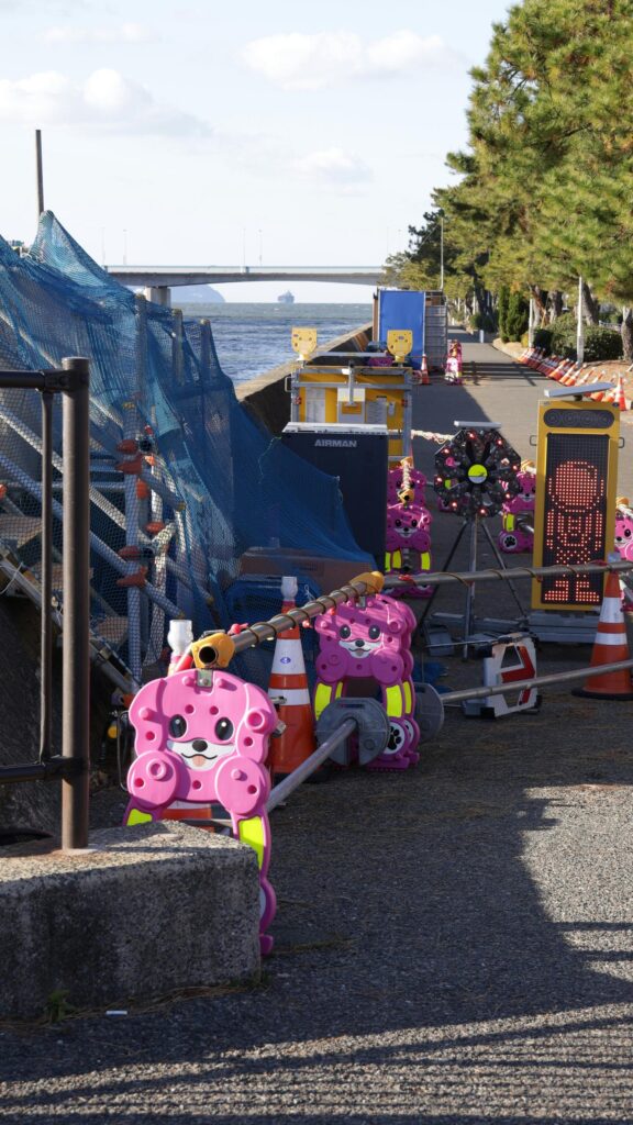 Cute Pink Animal Construction Barriers Seaside Road Phone Wallpaper