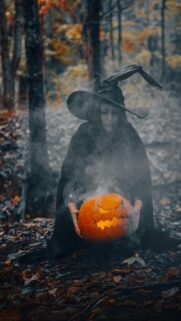 Mystical Witch with Smoking Jack-O’-Lantern Halloween Phone Wallpaper