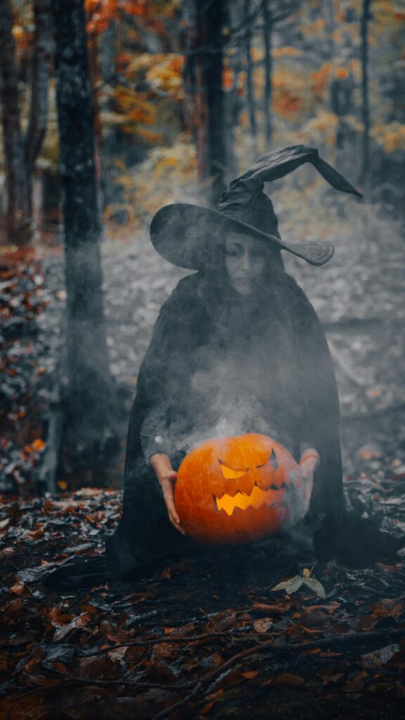 Mystical Witch with Smoking Jack-O'-Lantern Halloween Phone Wallpaper