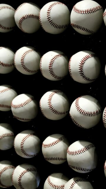 Grid of Clean White Baseballs on Black Background Mobile Wallpaper