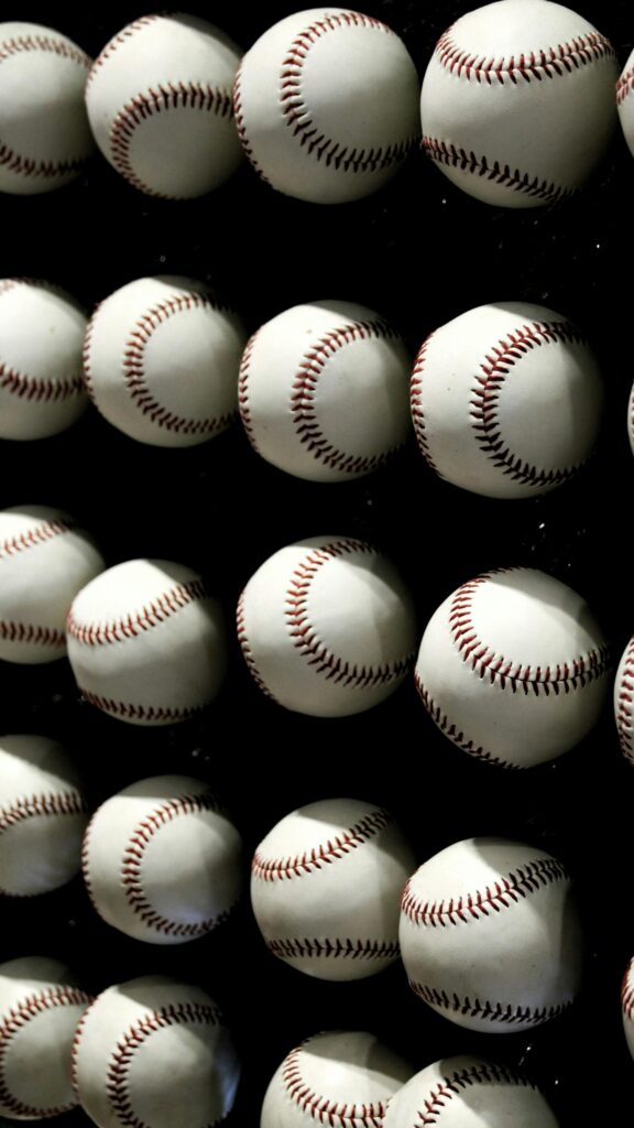 Grid of Clean White Baseballs on Black Background Mobile Wallpaper