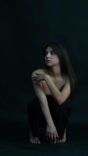 Stunning Minimalist Portrait of a Woman in Black Mobile Wallpaper
