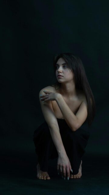 Stunning Minimalist Portrait of a Woman in Black Mobile Wallpaper
