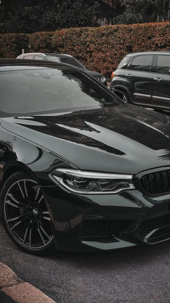 Dark BMW M5 Sport Sedan Front View Luxury Car Mobile Wallpaper