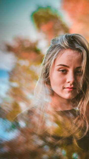 Portrait of a Blonde Woman with Artistic Motion Blur Bokeh Effect Wallpaper