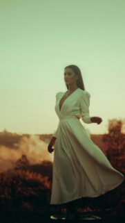 Elegant Woman in White Dress Sunset Cinematic Mobile Wallpaper