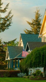Charming Suburban American Home with Flag Mobile Wallpaper