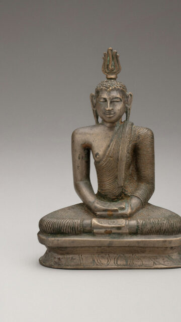 Serene Bronze Buddha Statue for Mindfulness and Zen Meditation Wallpaper