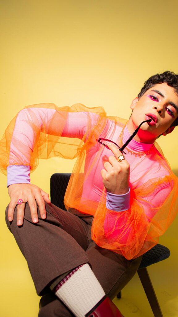 Vibrant Queer Fashion Portrait with Neon Pink and Orange Aesthetic Wallpaper