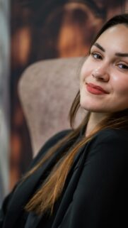 Elegant Woman in Chic Black Blazer Portrait Mobile Wallpaper