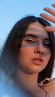 Stunning Close-Up Portrait of a Girl with Golden Hour Sunlight Wallpaper