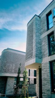 Modern Architectural Brick Building with Lattice Facade Wallpaper