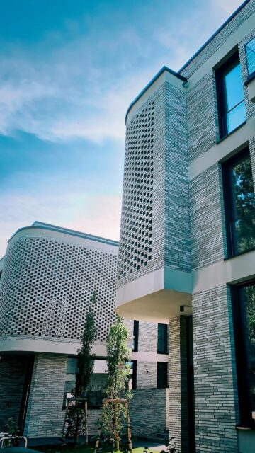 Modern Architectural Brick Building with Lattice Facade Wallpaper